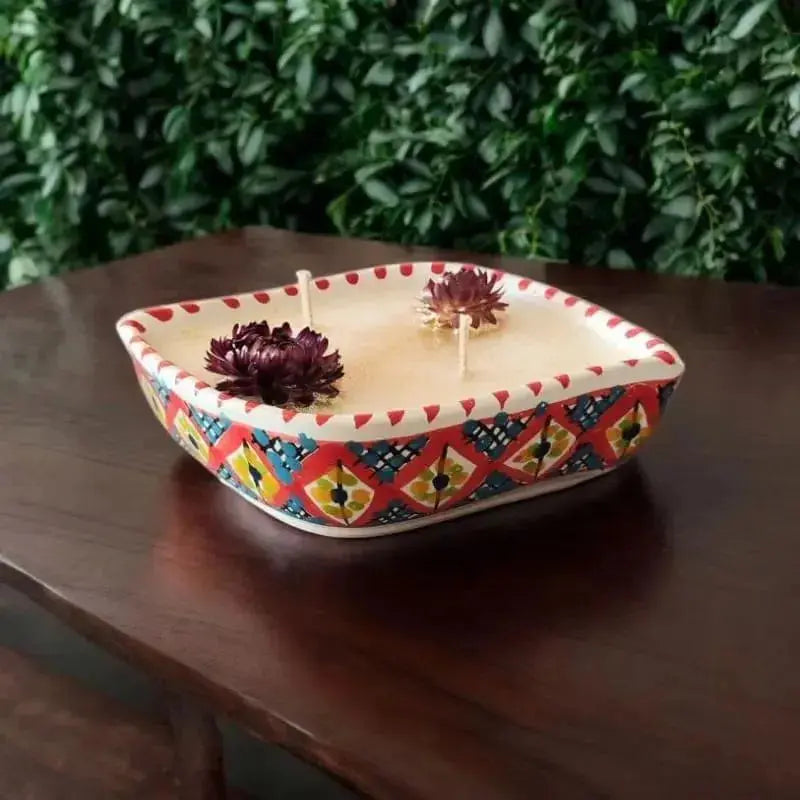 Bougie artisanale oeil en céramique couleur rouge de Nabeul décorée avec des fleur 