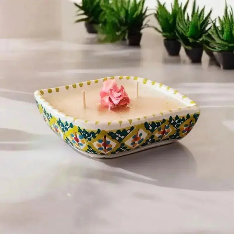 Bougie artisanale oeil en céramique couleur Anis décorée 